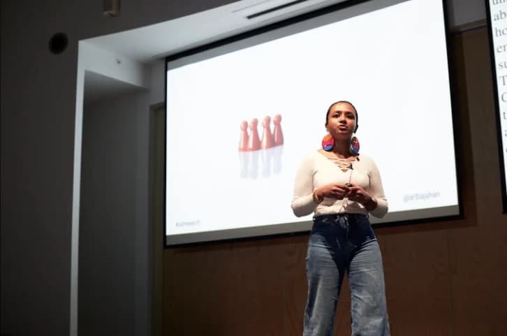 Ariba Jahan speaking on stage